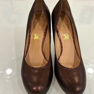 Modern vintage copper/brown leather pumps with snakeskin heel.